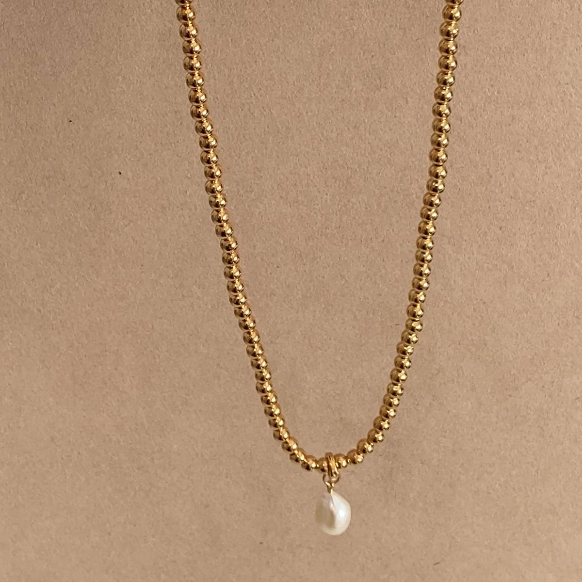 BELIEF NECKLACE & CELINE PEARL PENDANT